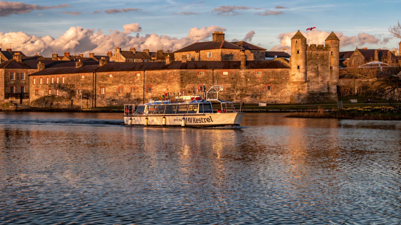 The MV Kestrel cruising past Enniskillen Castle on Lough Erne
