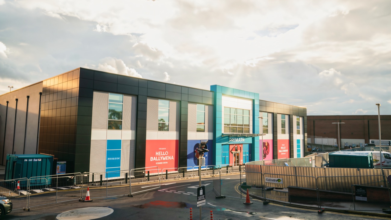 The new Primark building on the Fairhill site with 'Hello Ballymena' hoardings wrapping the front before opening