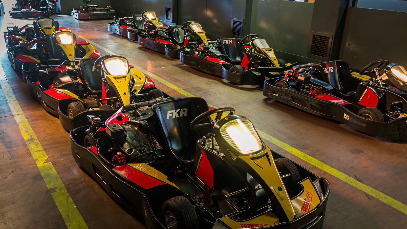 The kart fleet lined up indoors between races