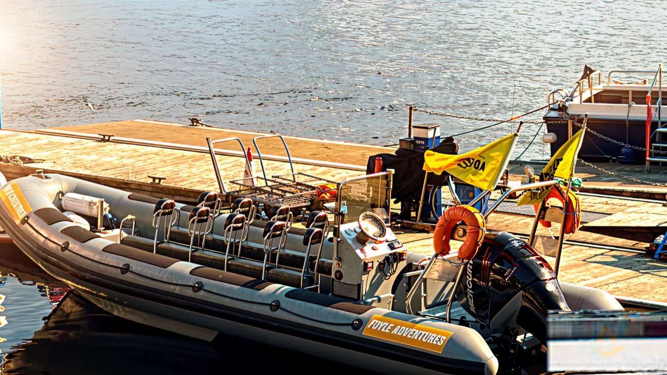 The Foyle Adventures RIB at the jetty, flags flying, ready for the off.
