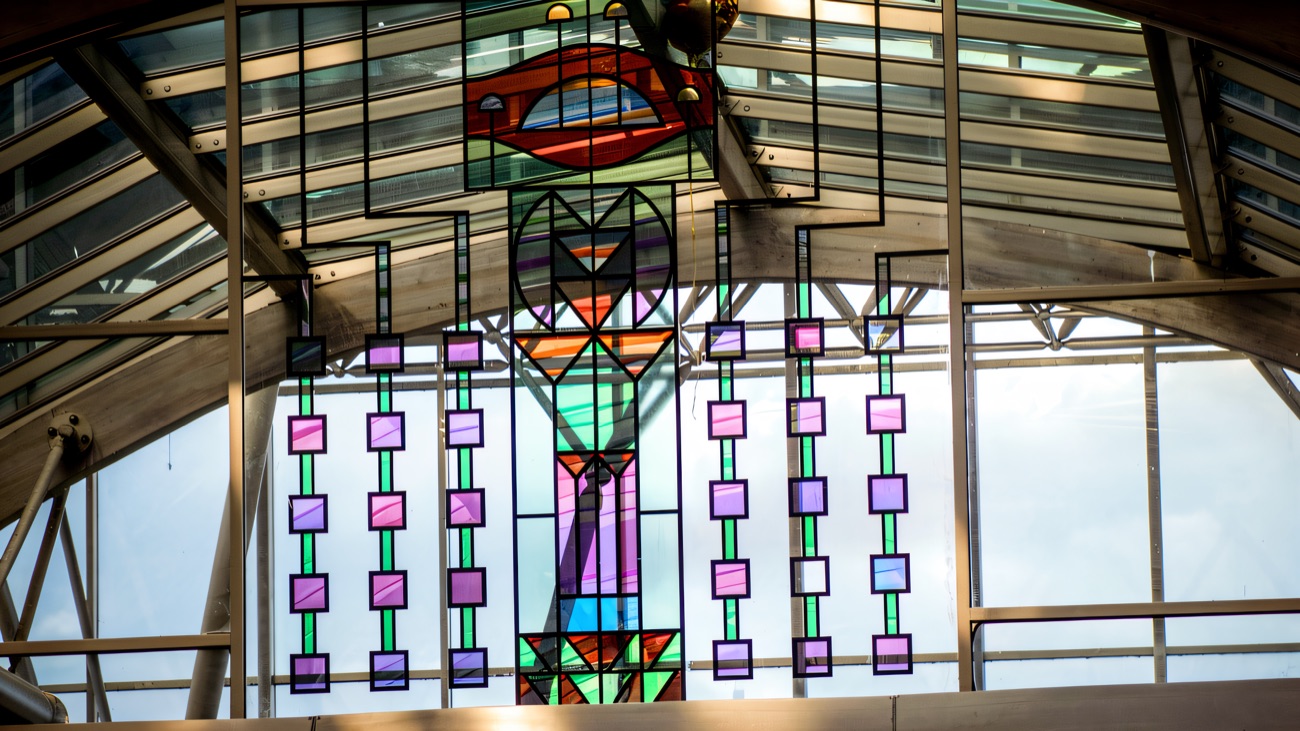 The colourful stained-glass artwork set into the arched glass roof above the mall at Foyleside