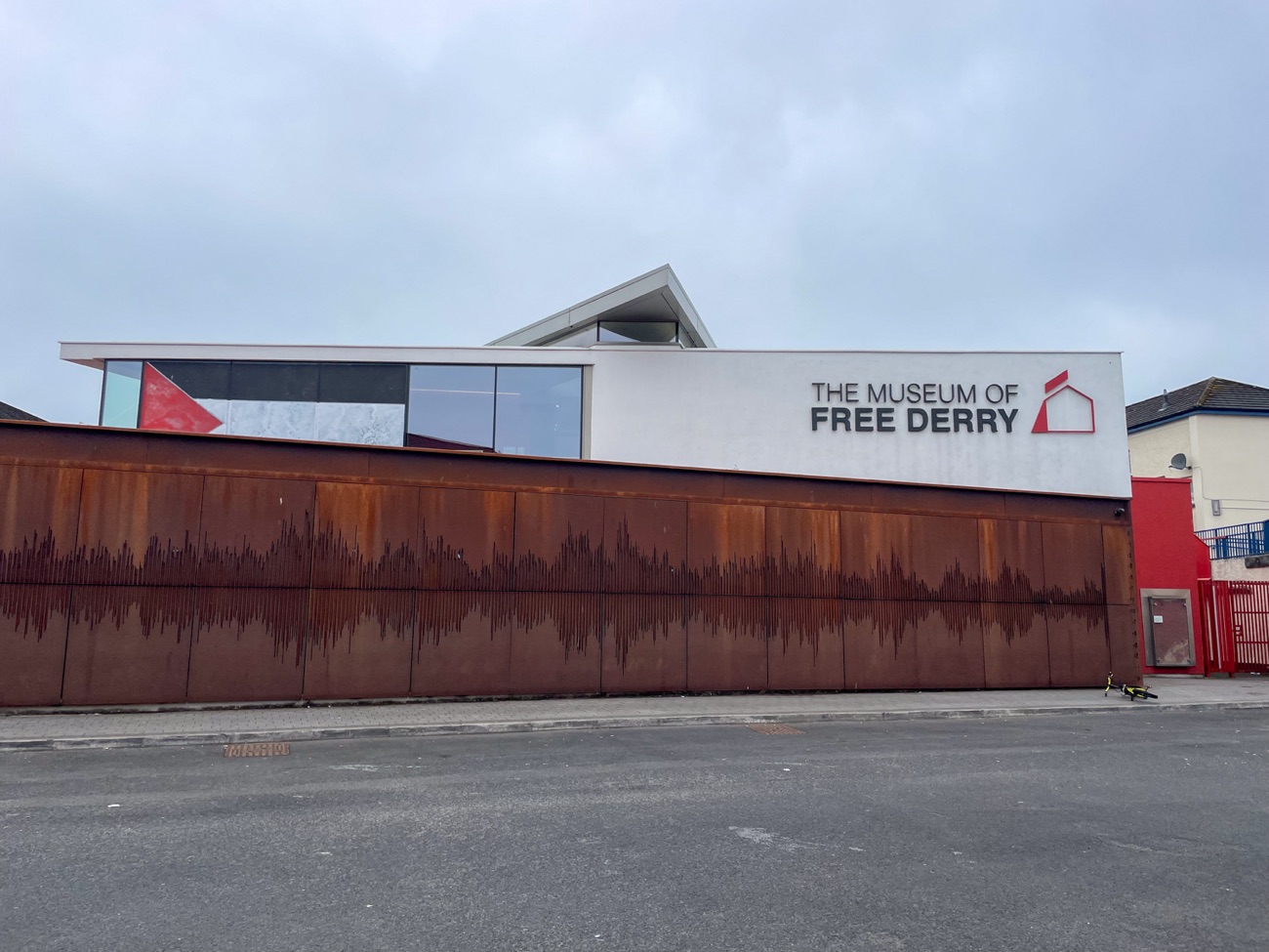 The Museum of Free Derry, a modern corten-steel building with its name on the front