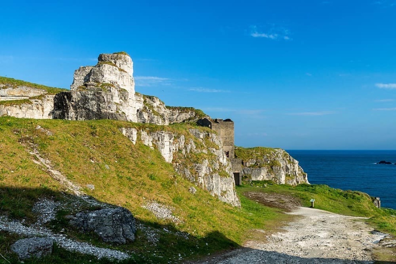 The white limestone quarry face and old workings on the path at Larrybane