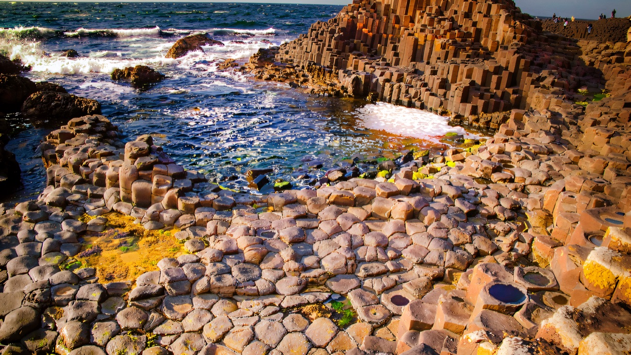 A wide view over the stepping-stone columns and the sheltered bay beyond.