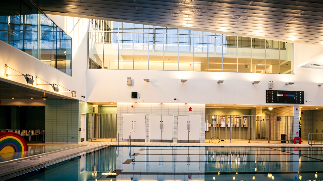 The bright pool hall with its rainbow feature at the shallow end