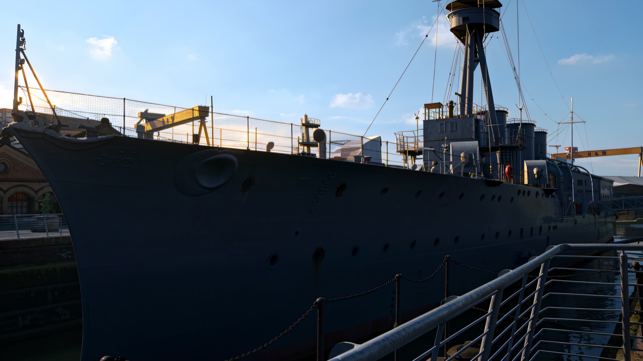 Looking along the grey hull towards the bridge and mast.
