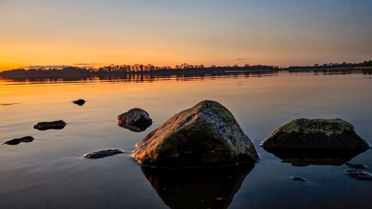 Sunset over the rocky shore of Lough Neagh