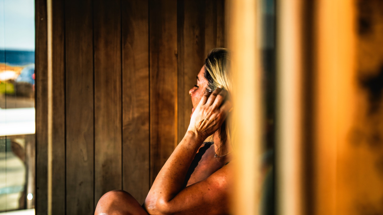 Warm light on the timber benches inside the cabin