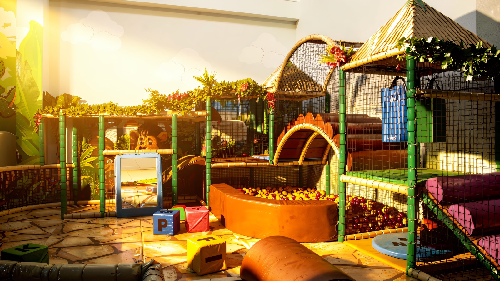 The jungle-themed Indiana Land soft play frame with green bamboo-style posts, netting, foliage and a padded ball pit