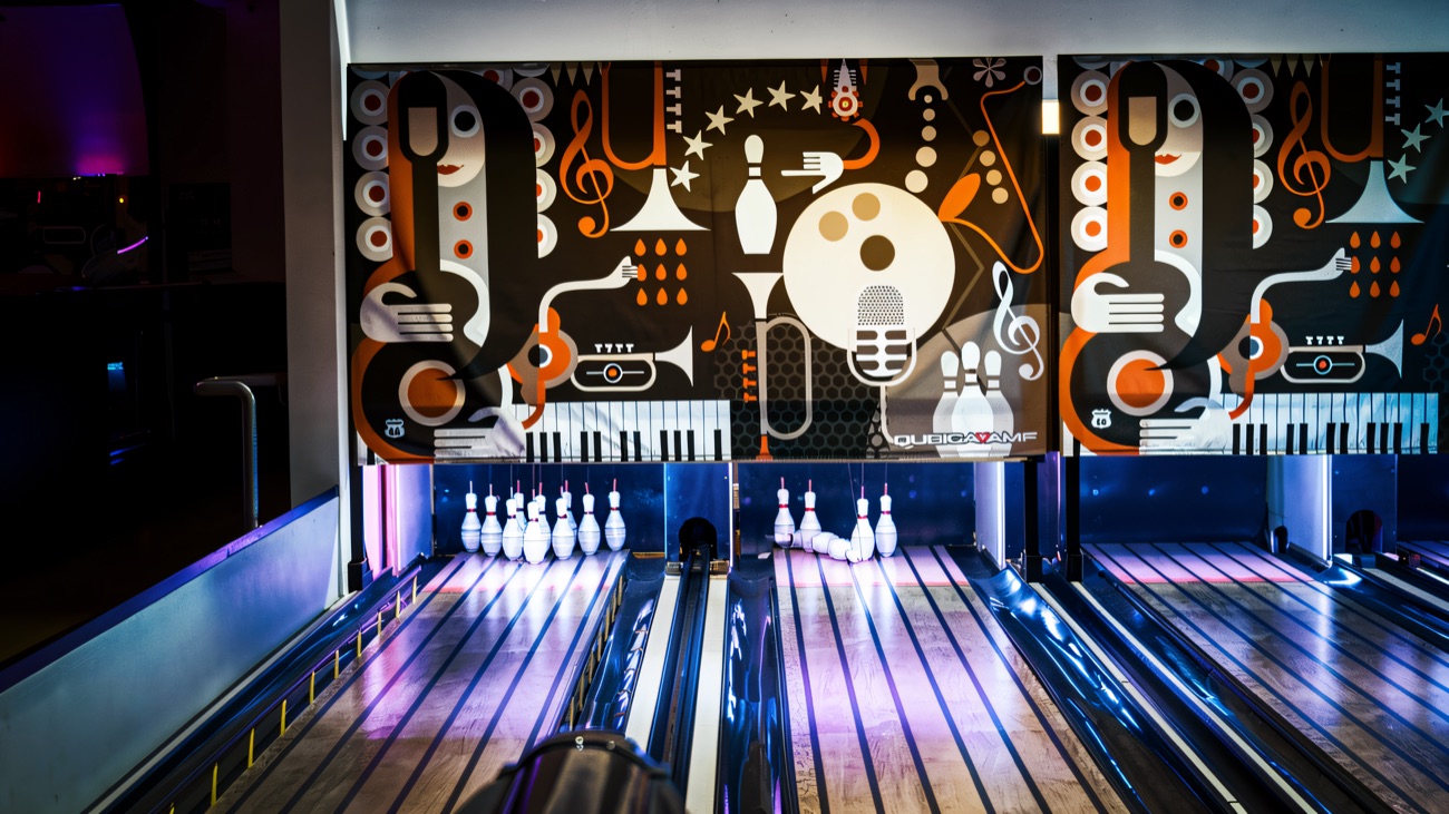 The mini bowling lanes with their bright wall mural