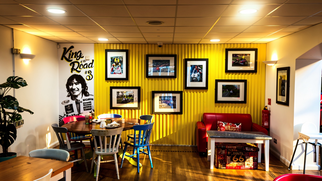 The cafe seating area beneath a large Joey Dunlop mural
