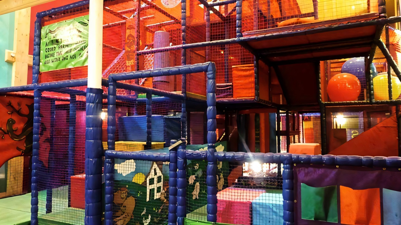 The multi-level Little Rambo's soft play frame with padded netting, climbing platforms and a ball pit