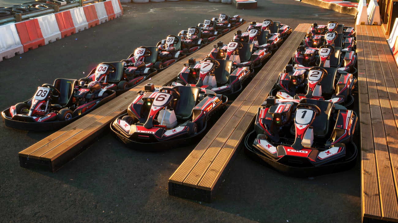 The numbered kart fleet lined up and ready in the paddock