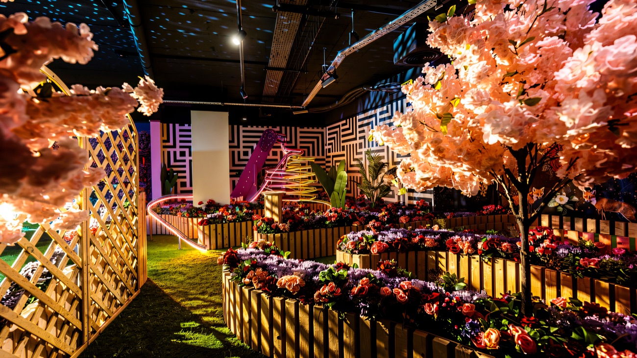 The full flower garden course lit up with cherry blossom and neon