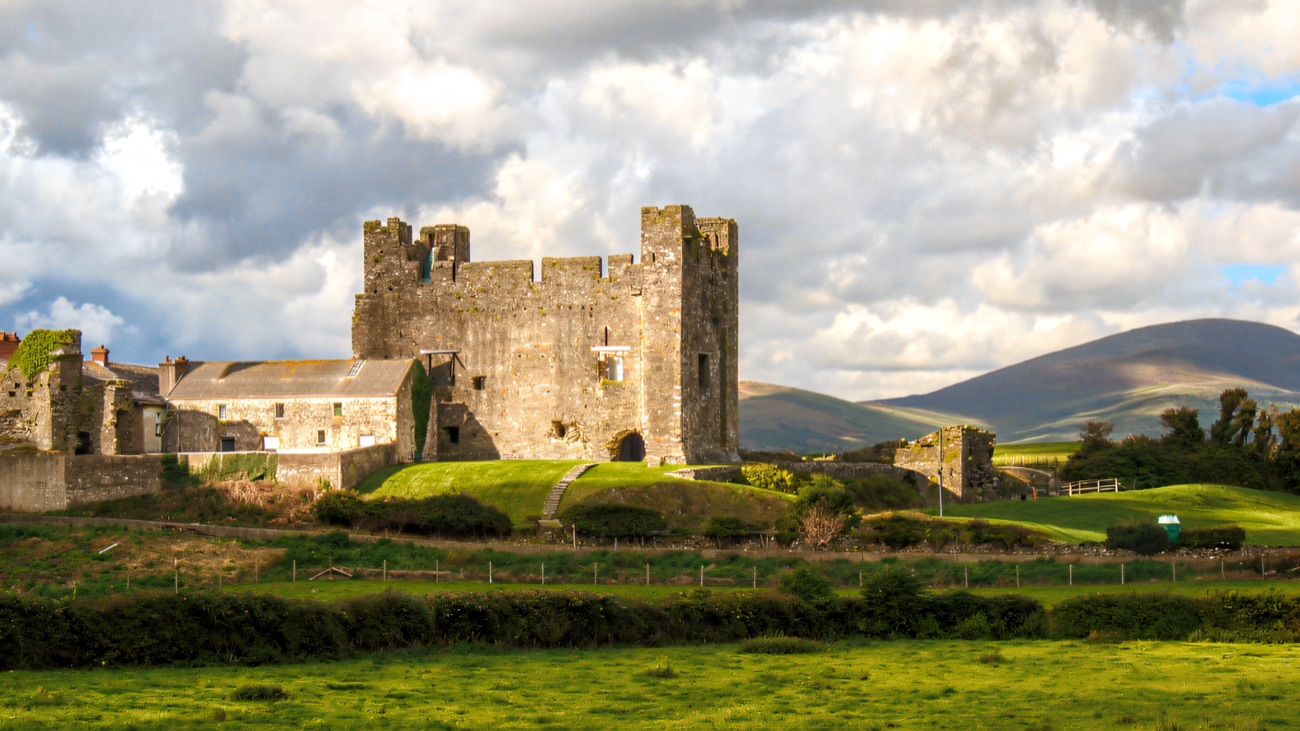 Greencastle's Norman keep with the Mourne foothills beyond