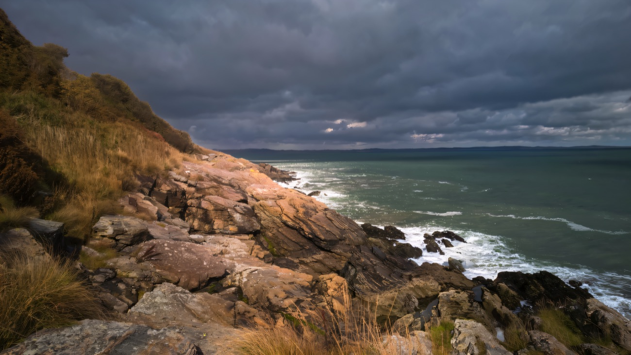 Waves breaking along the rocky Mourne shoreline