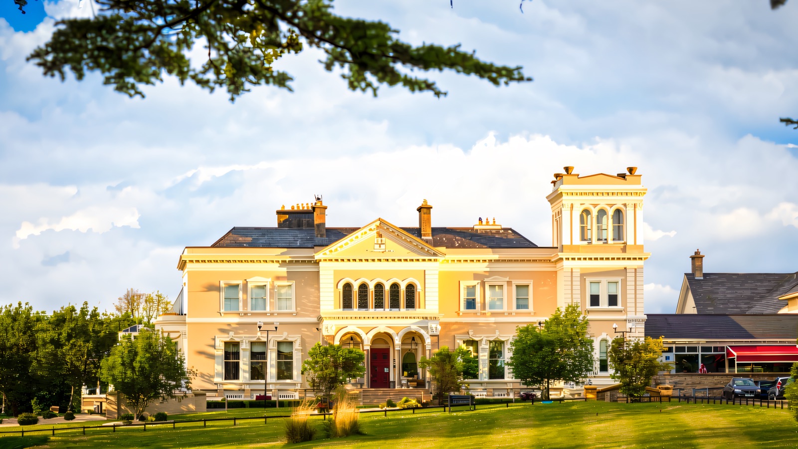 The honey-coloured Victorian Manor House Hotel at Killadeas, with its central tower, arched entrance and wide green lawns