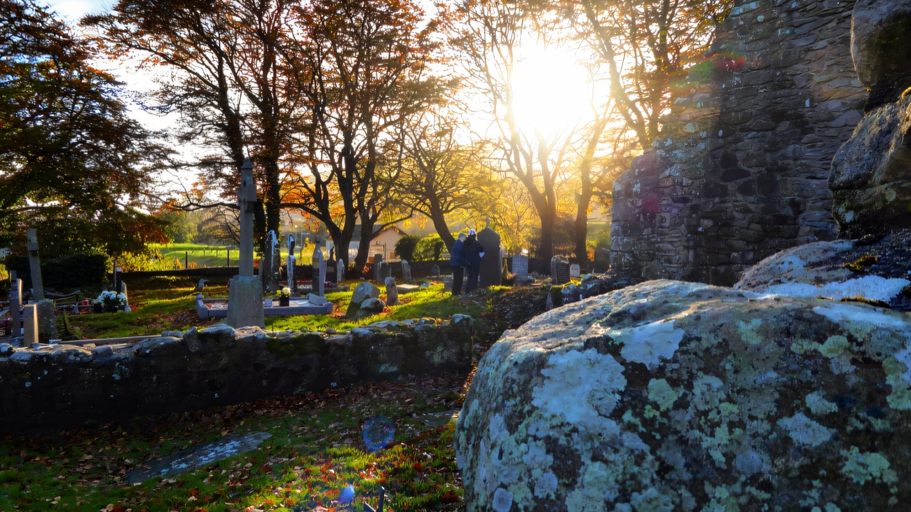 Low autumn light filters through the trees over the old graveyard at the foot of Slieve Gullion.