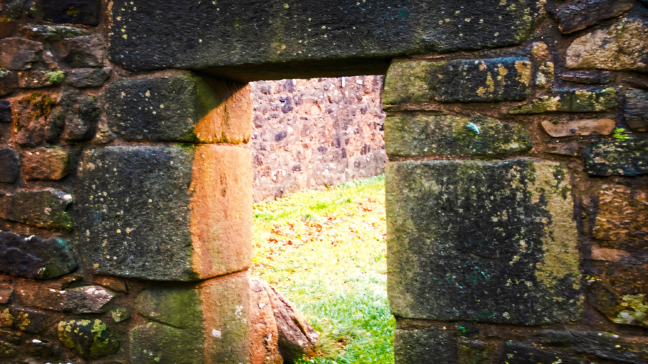 The massive stone lintel above the west doorway, a striking survival from the early medieval church.