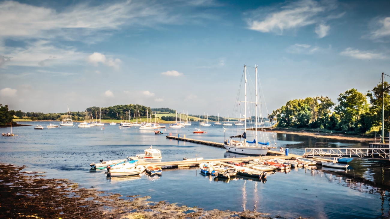 Boats moored at Killyleagh harbour on Strangford Lough on a bright day