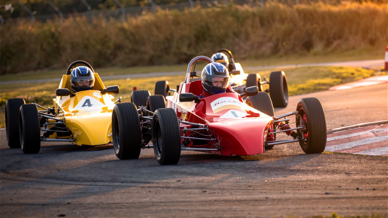 Formula single-seaters battling wheel-to-wheel at Kirkistown
