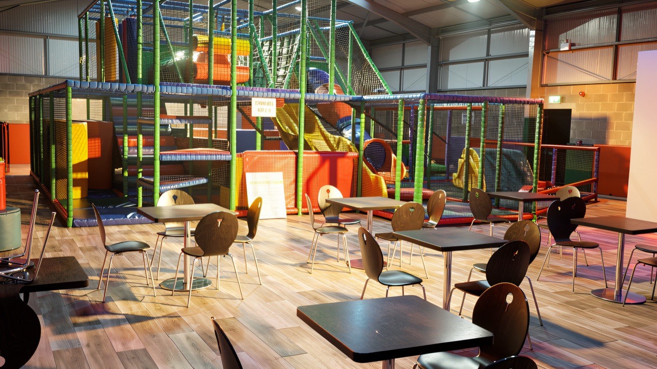 The multi-level indoor play frame with café tables set out in front