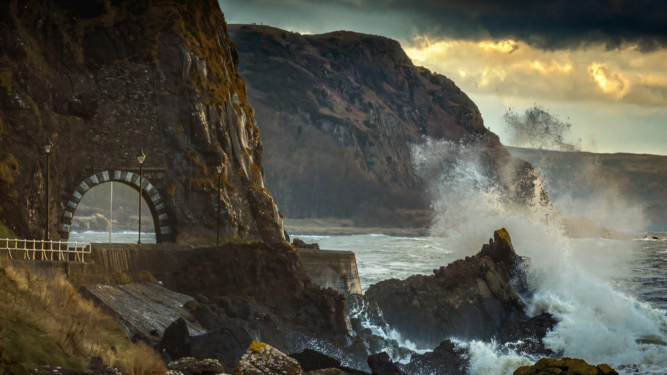 Waves crashing beside the Black Arch on the Larne coast
