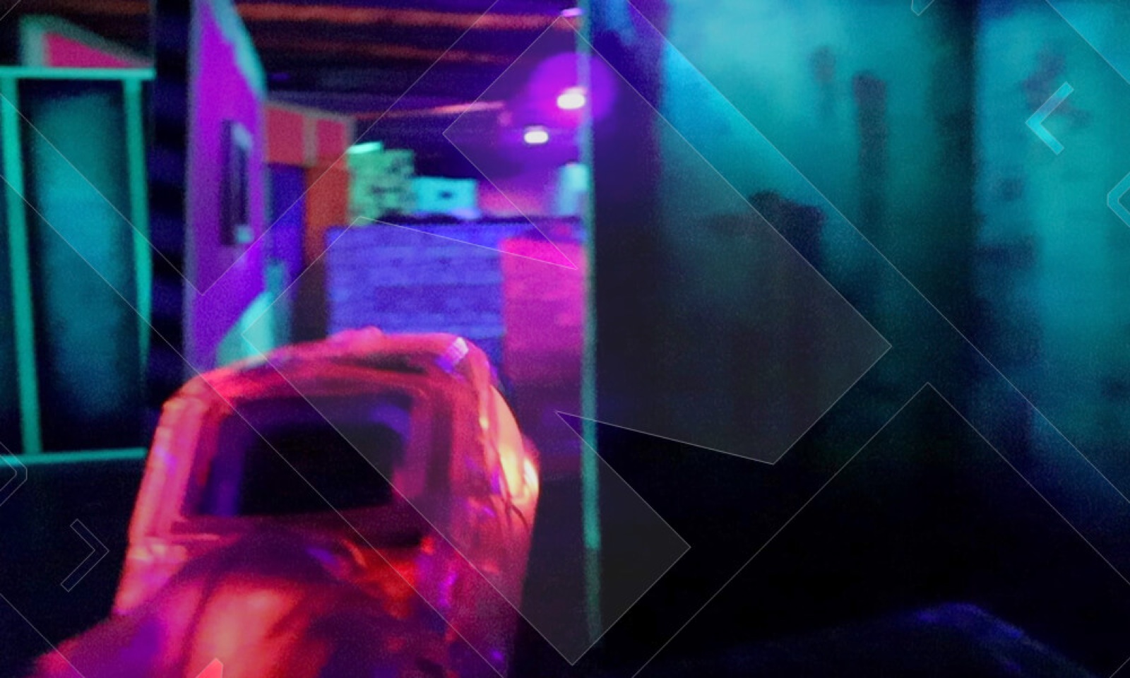 The neon blacklight combat arena at Lock N Load