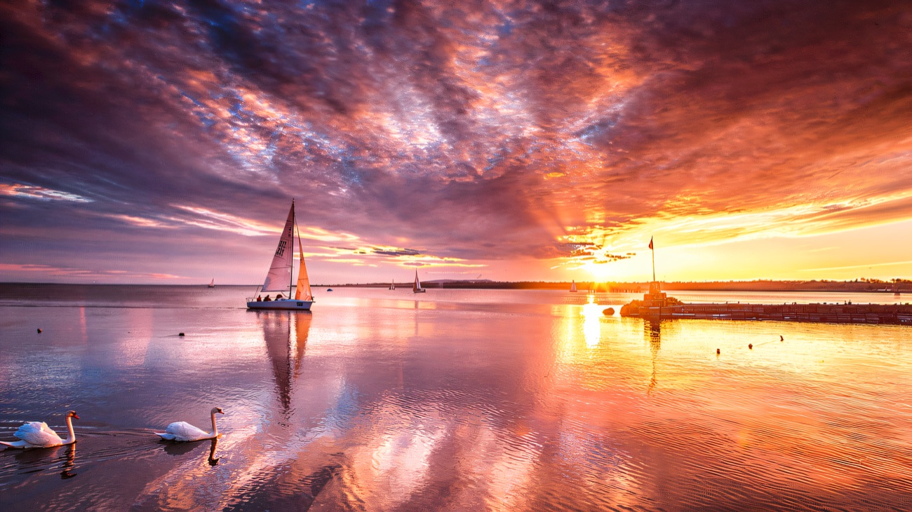 Swans, a yacht and a blazing sunset over the lough