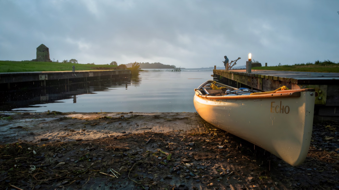 Canoe ready at the slipway on a still lough morning