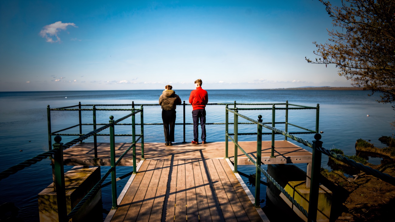 A jetty reaches out over the vast calm of Lough Neagh