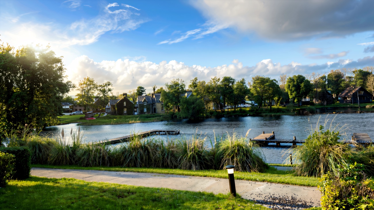 Green lawns and glassy water on a bright morning