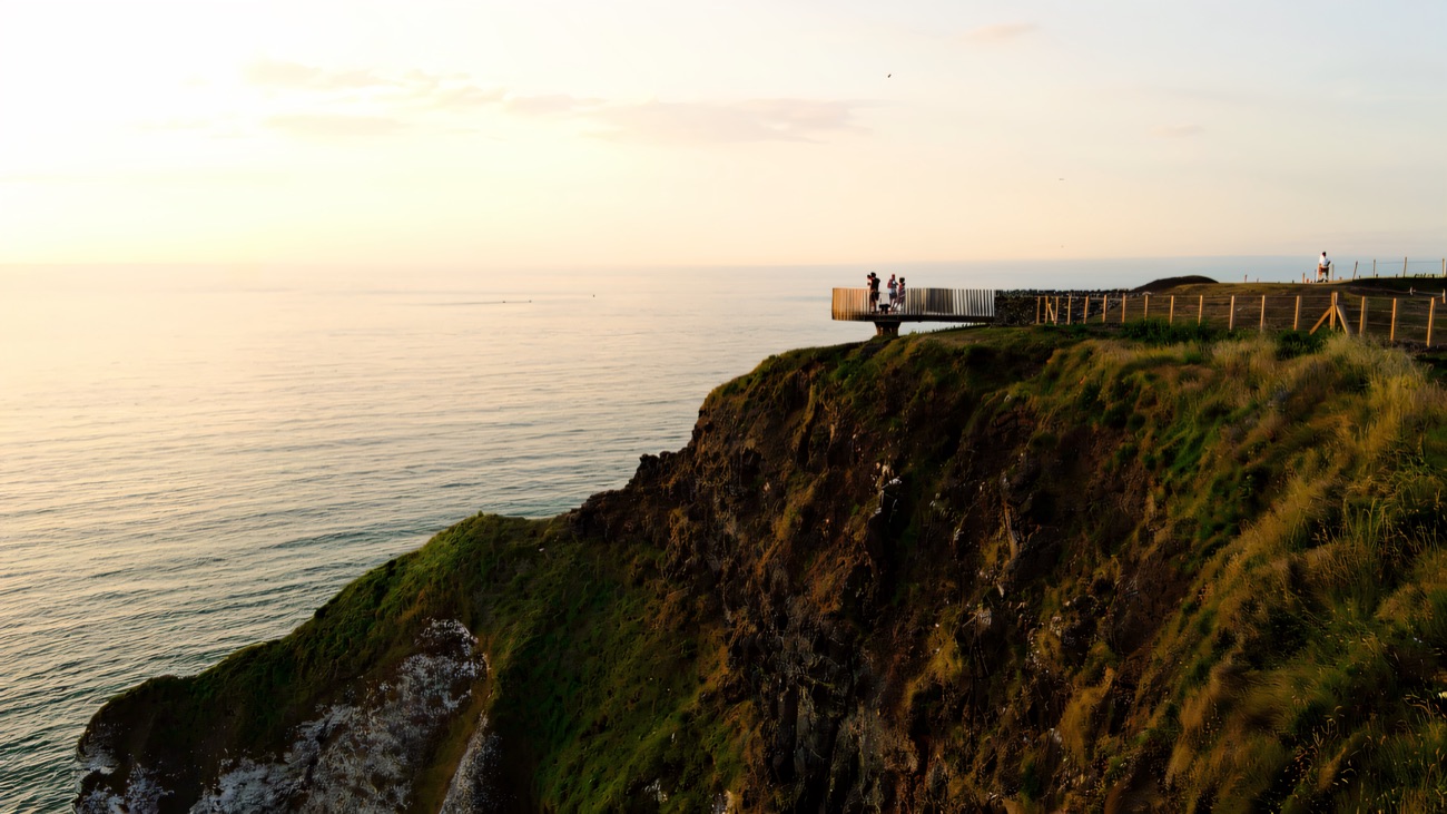 The platform perched on the cliff edge in evening light