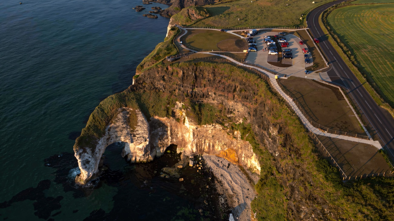 The limestone sea arch in the cliffs below the viewpoint
