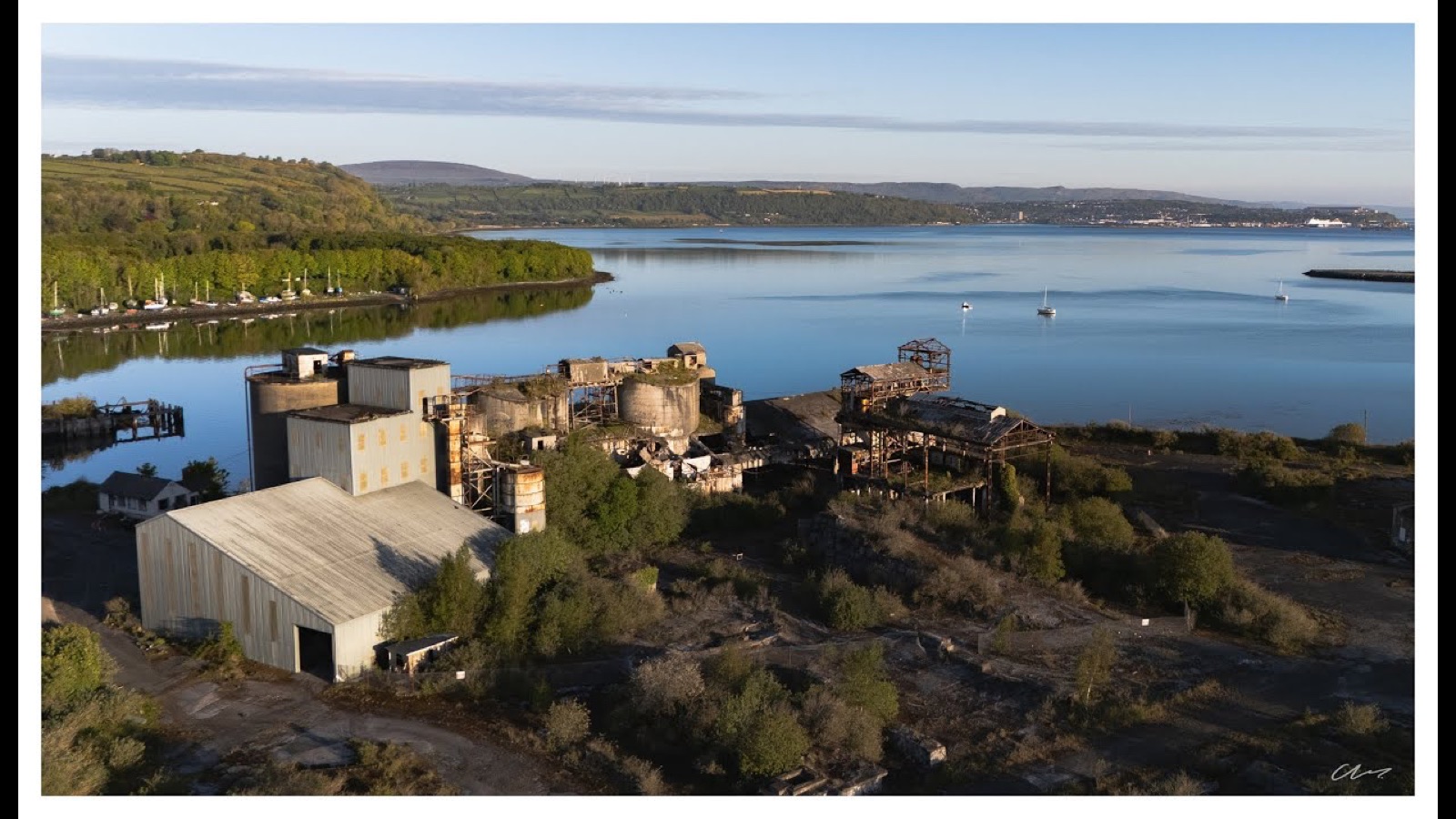 Aerial view of the former Magheramorne quarry works on the shore of Larne Lough