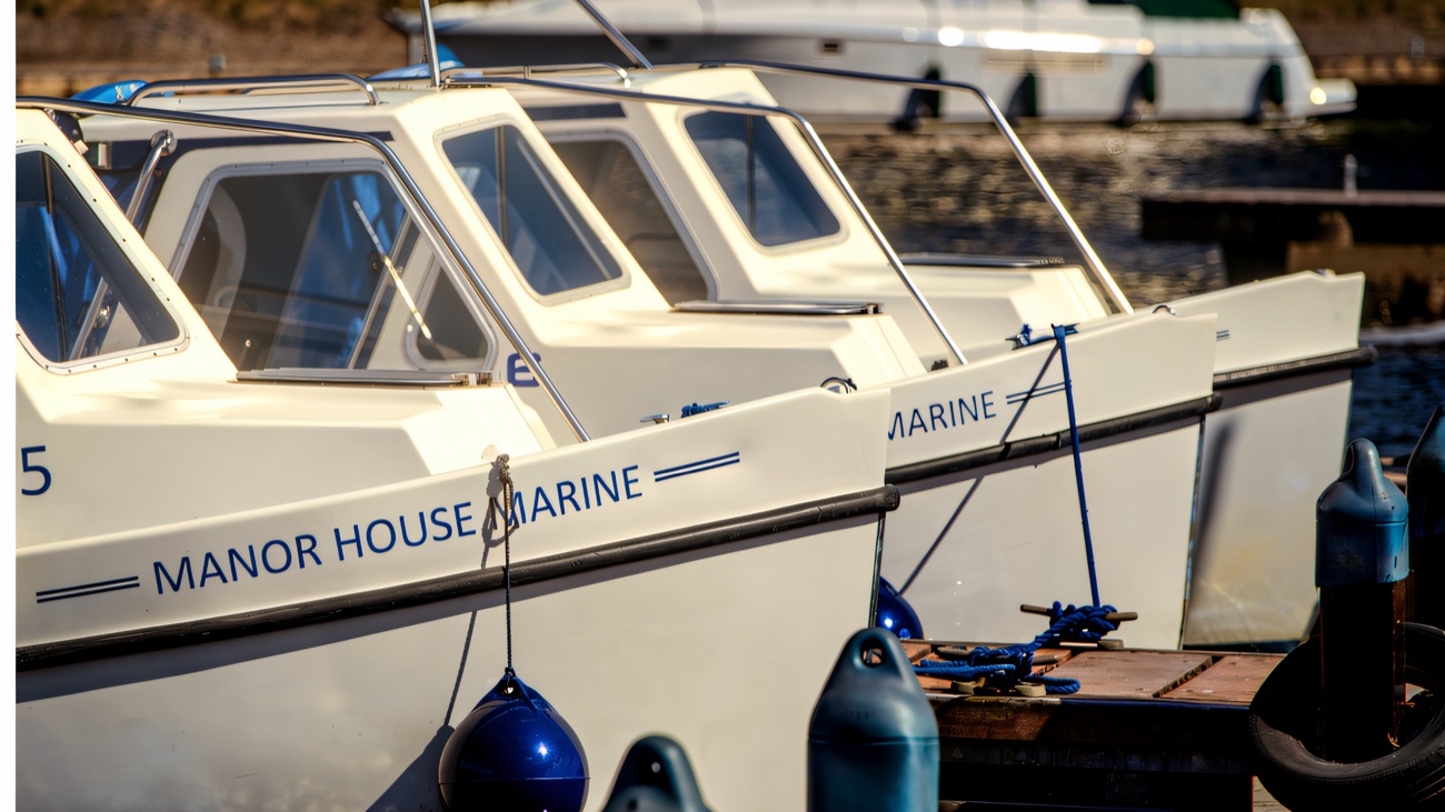 Manor House Marine's hire boats lined up at the marina