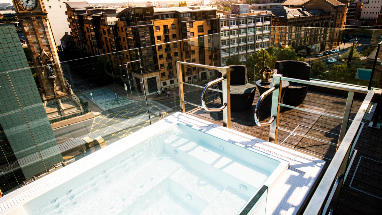 The rooftop hot tub, looking out over the rooftops of Belfast and the Albert Clock.