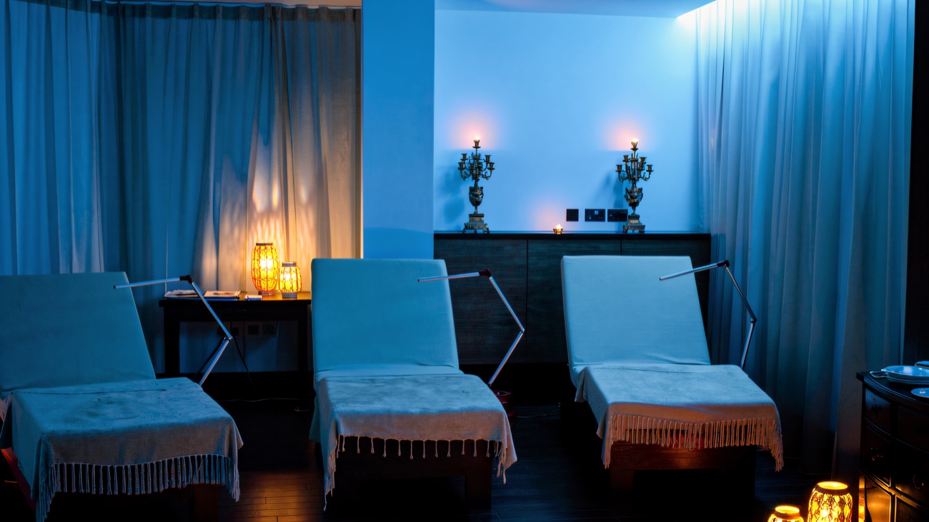 The relaxation room, with heated loungers and candlelight for winding down between treatments.