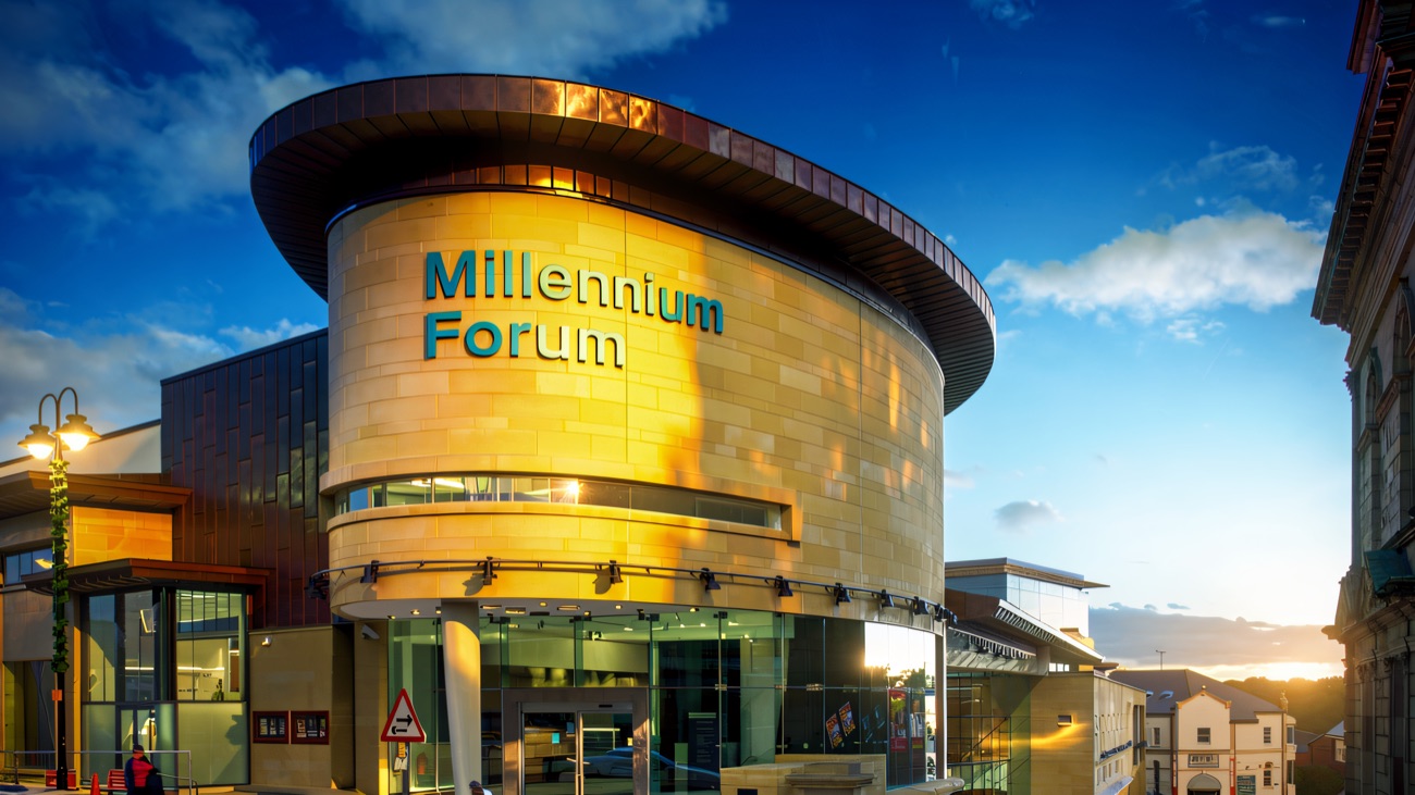 The Millennium Forum's landmark drum facade under blue skies