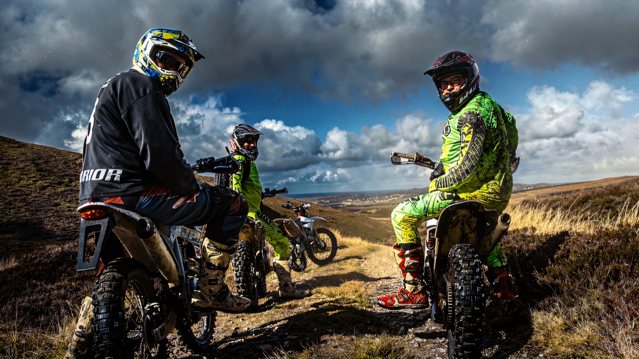 Off-road bikes and riders out on the open hill trails