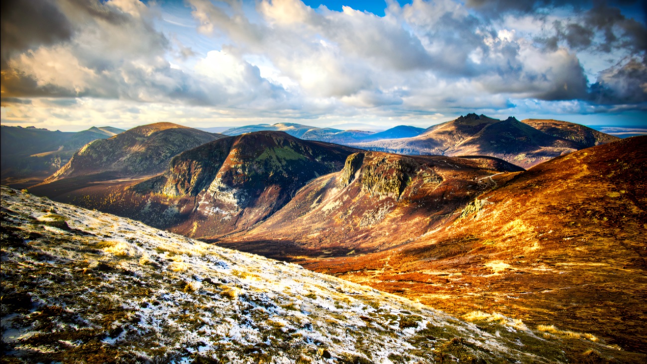 A wide panorama across the heart of the Mourne range