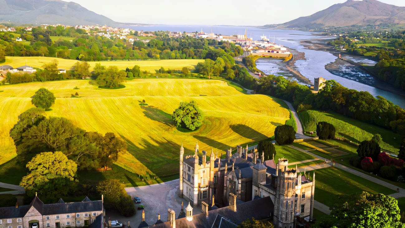 The castle and parkland above the Newry river and lough