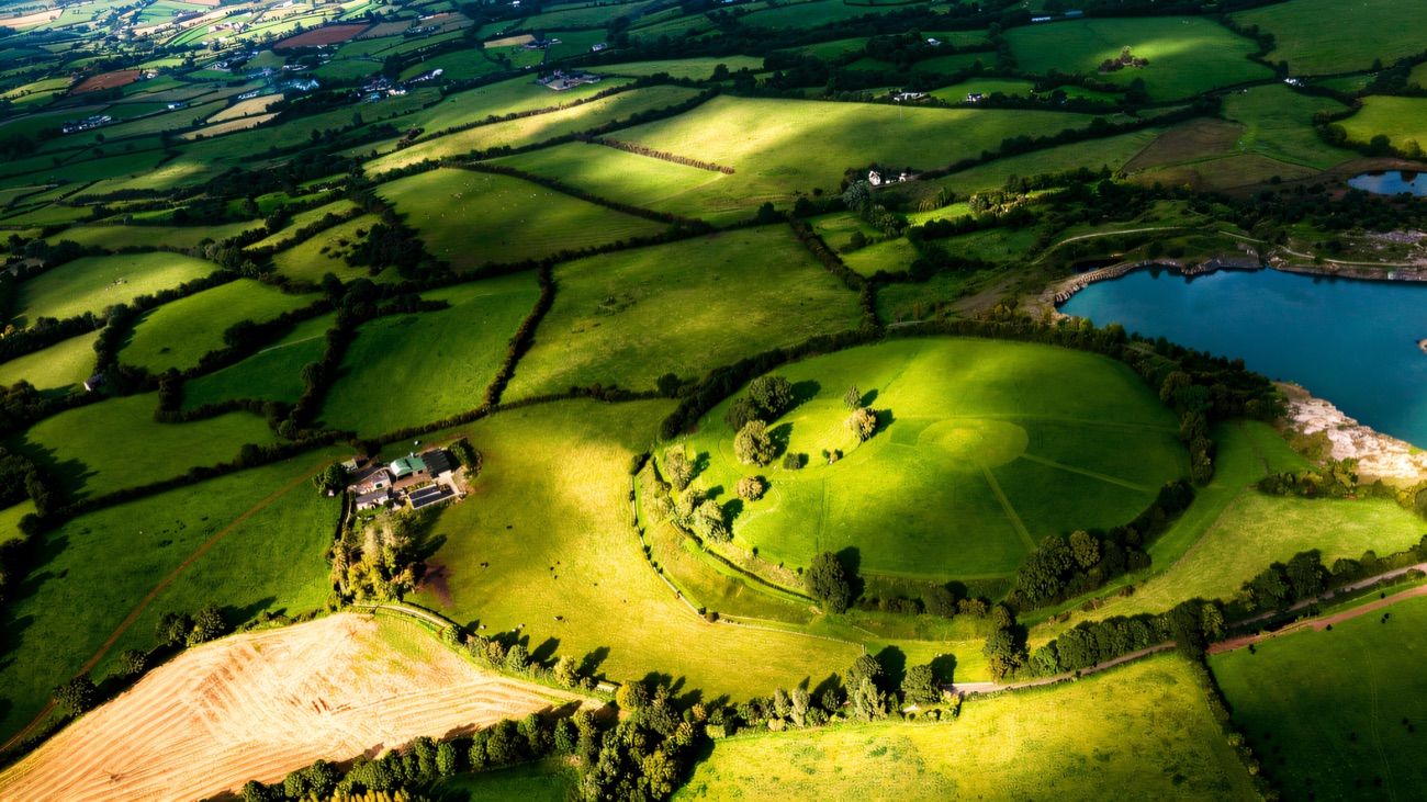 The ancient ring set among patchwork fields near Armagh, seen from a different light.