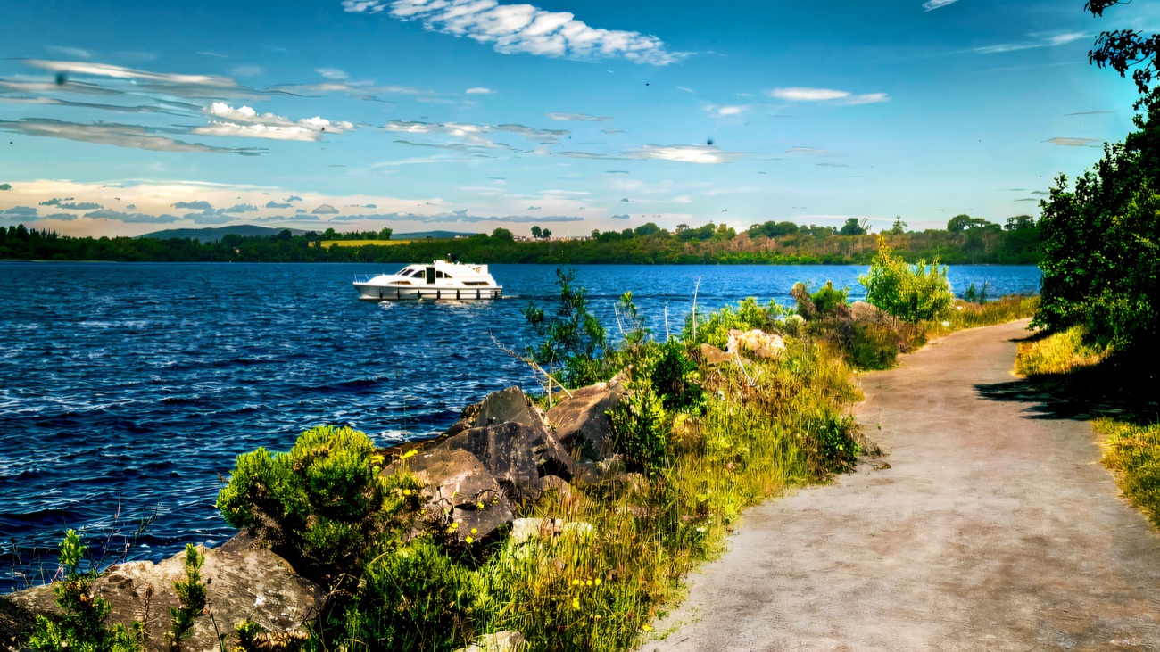 The lakeside trail beside Lower Lough Erne, a cruiser on the water