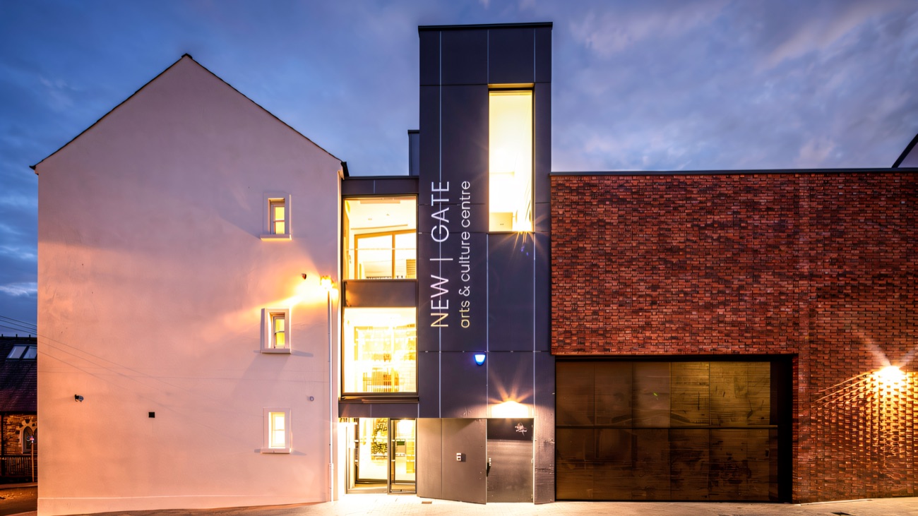 The signed entrance at twilight