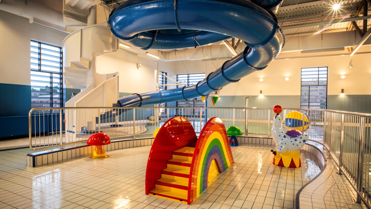Shallow toddler pool and water slide at the family end of the pool