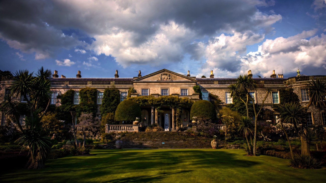 The grand south front of Mount Stewart house above its manicured lawns.