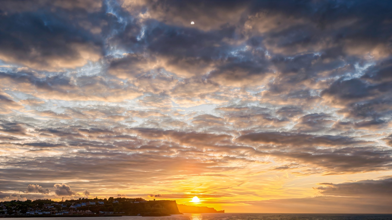 Sunset over Ballycastle beach with Fair Head beyond