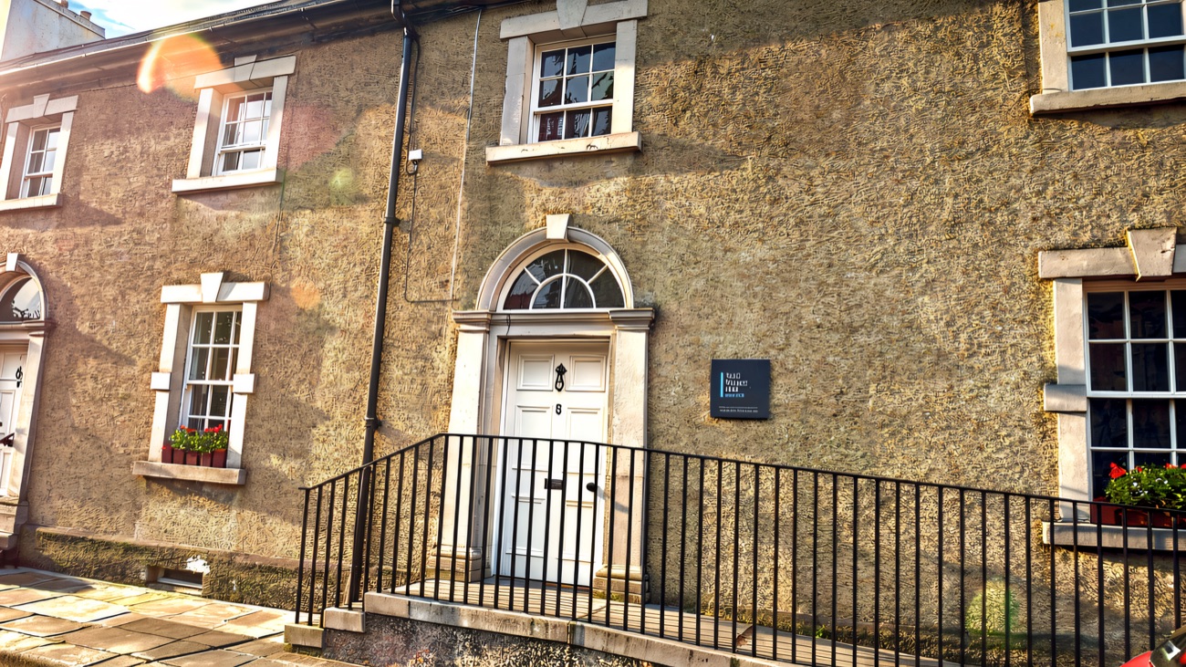 The fanlit doorway of No. 5, home to a small treasury of the cathedral's rare books and manuscripts.