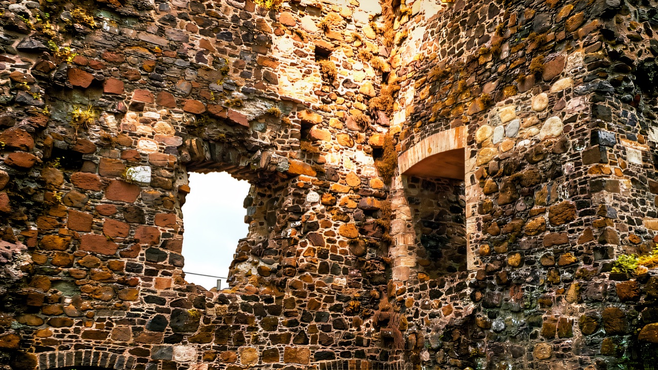 Inside the tower, looking up at the wall openings and fireplaces.